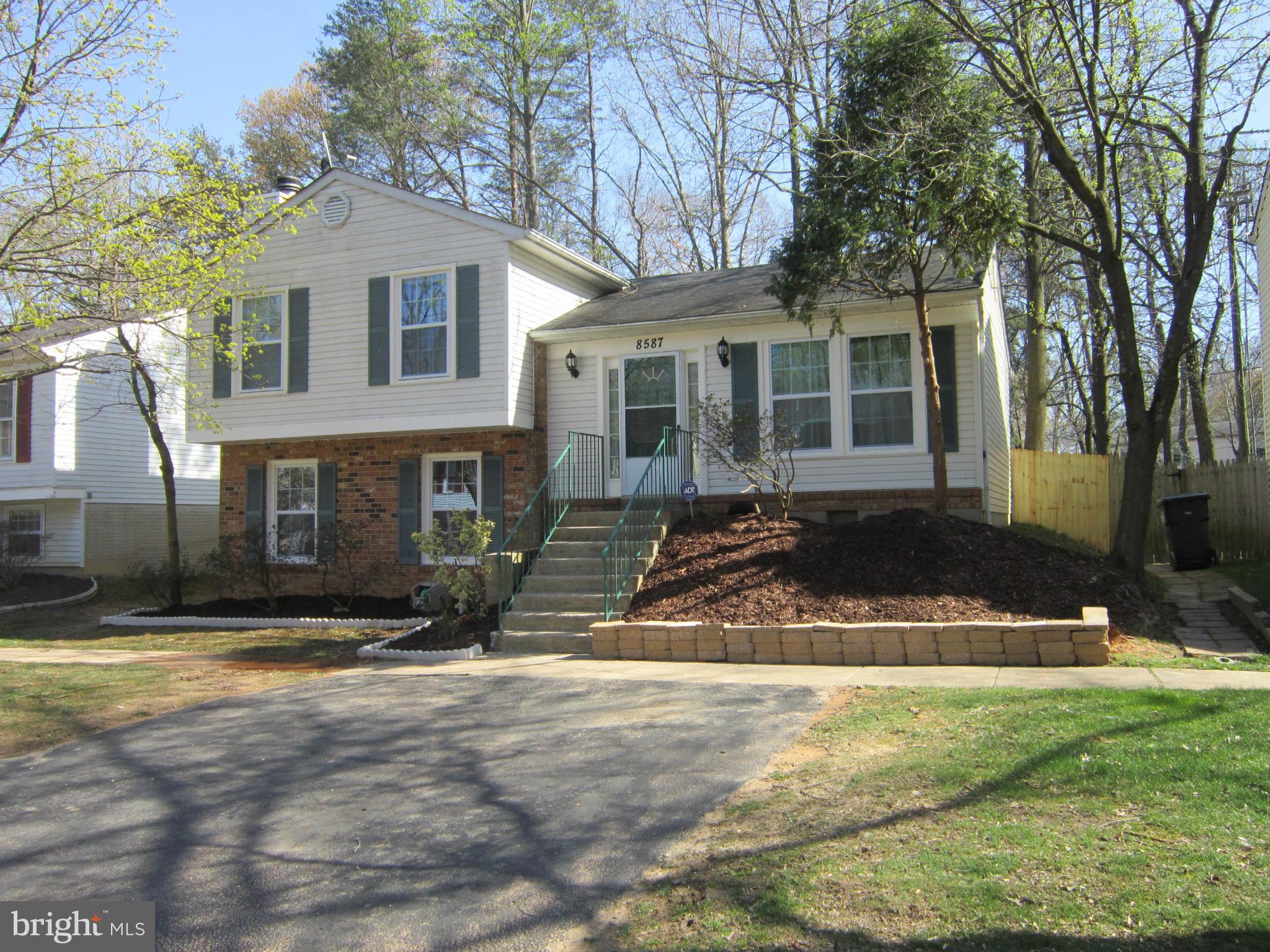 8587 Tyrolean Way Springfield, VA 22153 - Photo 30 of 30 a view of a house with a yard