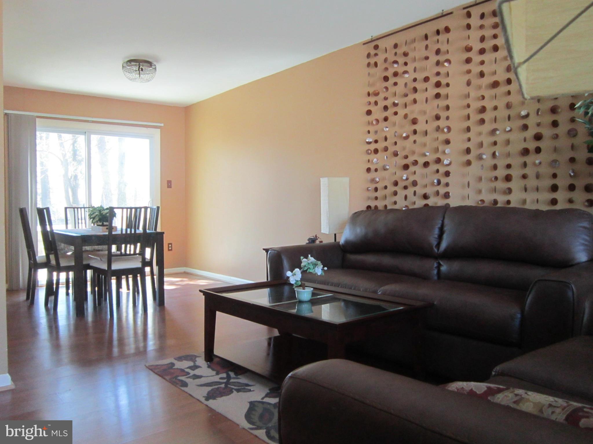 8587 Tyrolean Way Springfield, VA 22153 - Photo 5 of 30 a living room with furniture and wooden floor