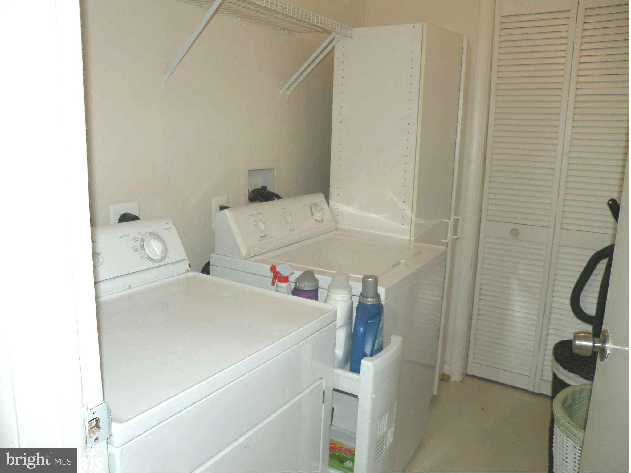 12705 Found Stone Road, Unit 301 Germantown, MD 20876 - Photo 15 of 21 a utility room with dryer and washer