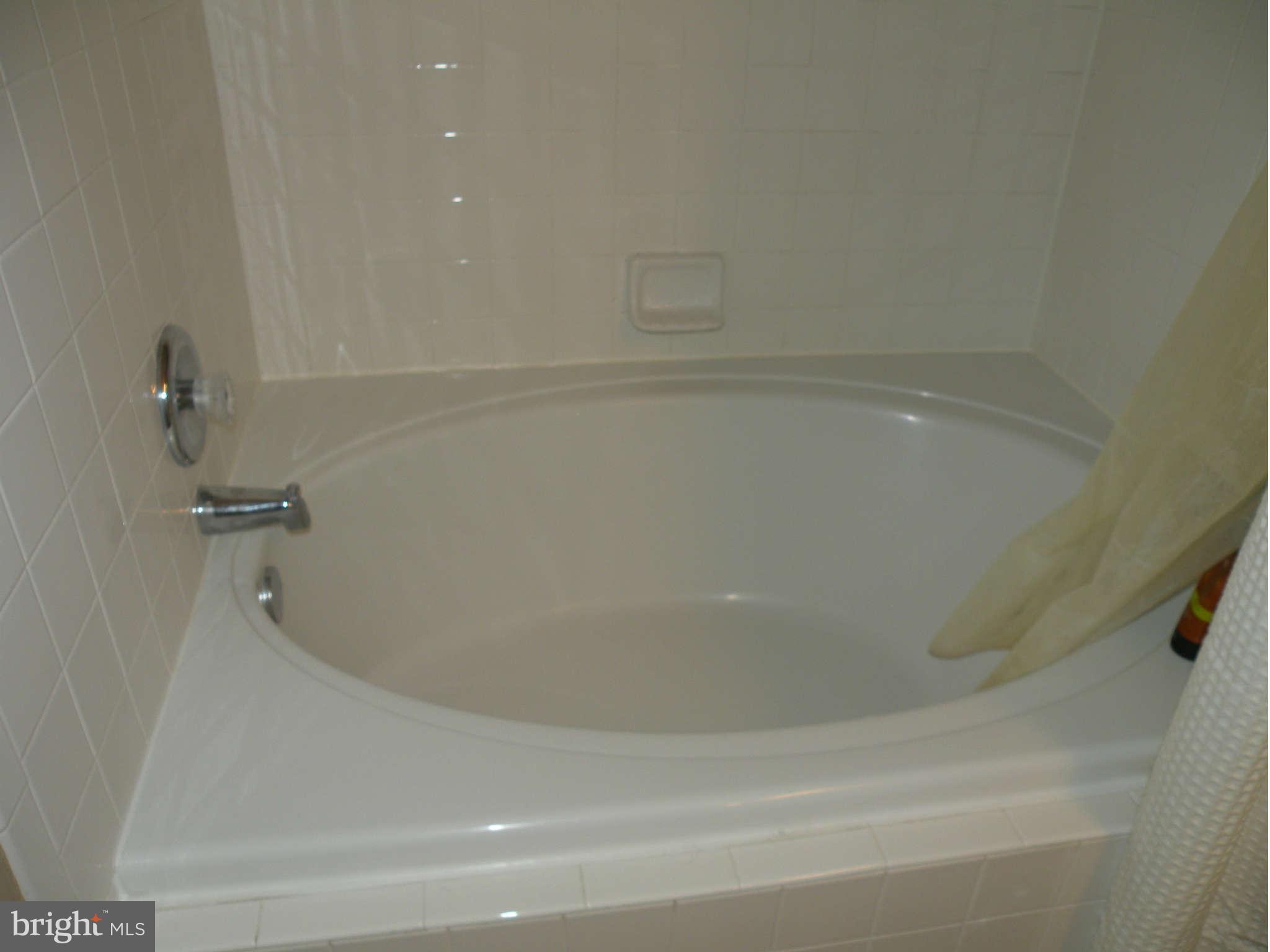 12705 Found Stone Road, Unit 301 Germantown, MD 20876 - Photo 18 of 21 a close view of a bathtub in bathroom