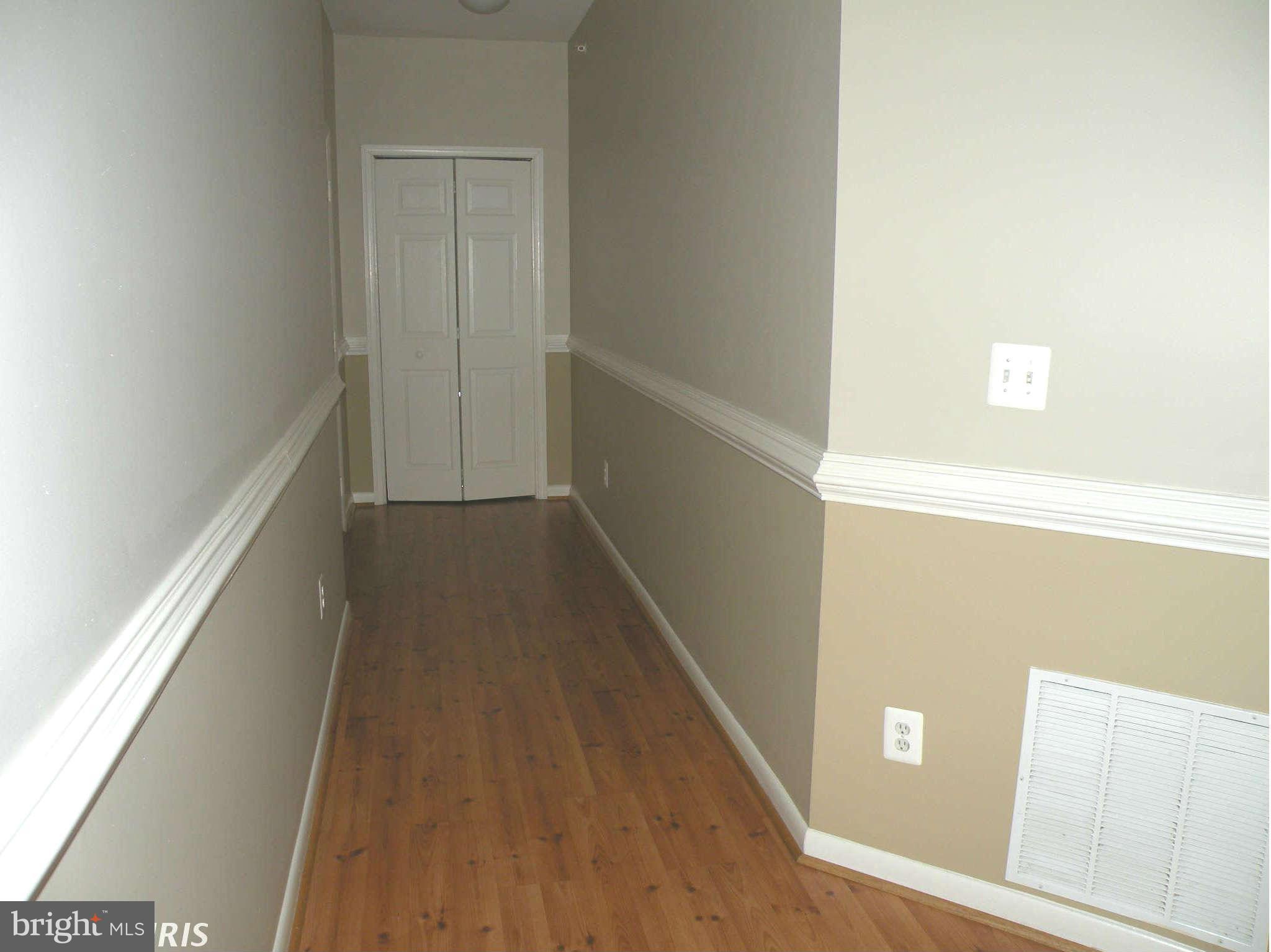 12705 Found Stone Road, Unit 301 Germantown, MD 20876 - Photo 21 of 21 a view of a hallway with wooden floor
