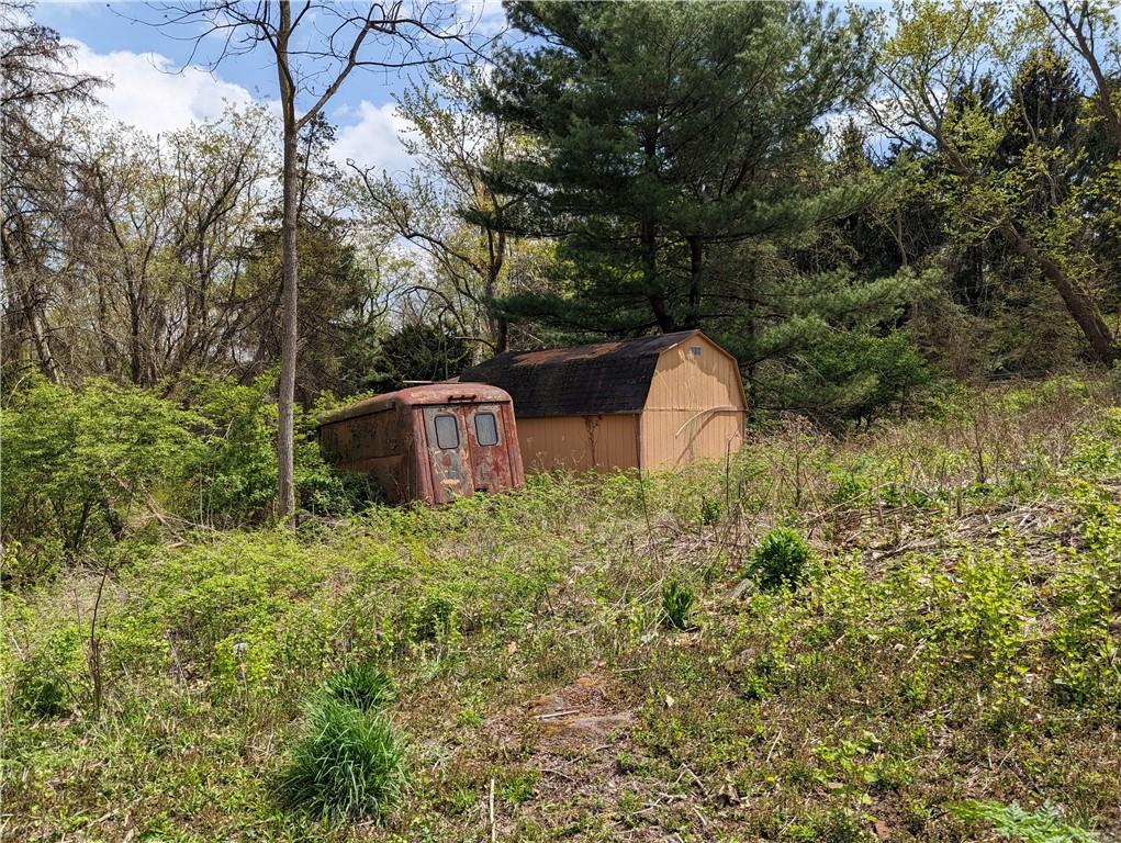 3326 New England Road West Mifflin, PA 15122 - Photo 7 of 12 a backyard of a house with lots of green space