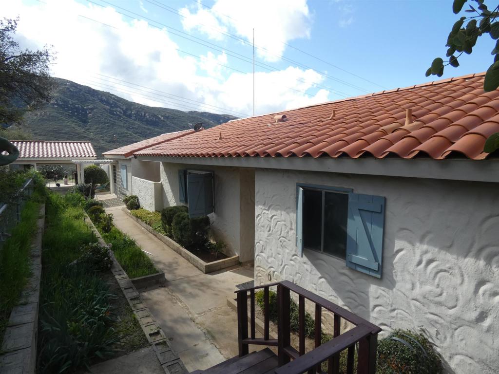 19515 Japatul Road Alpine, CA 91901 - Photo 1 of 1 a front view of a house with garden