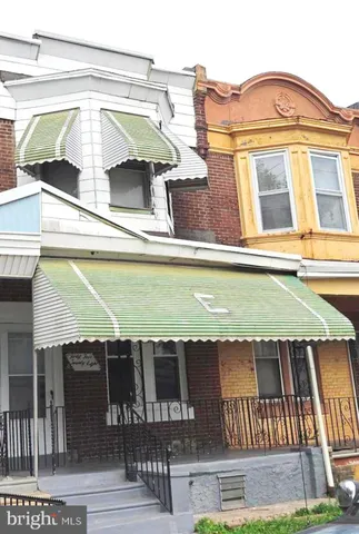 a view of a swimming pool with seating area
