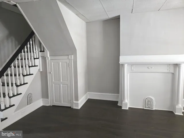 a view of an entryway with wooden floor