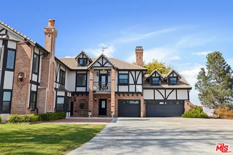 a outdoor living space with patio furniture and a potted plant