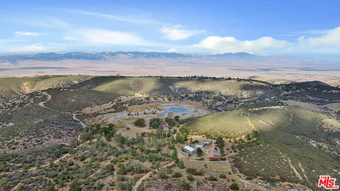 an aerial view of mountain with trees