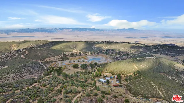 an aerial view of mountain with trees