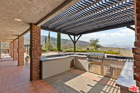 a view of a house with a mountain in the background