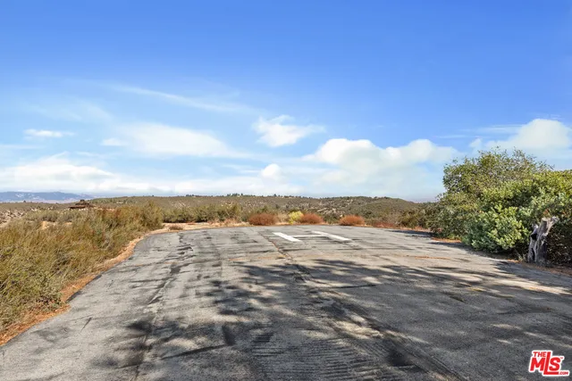 a view of a road with a trees