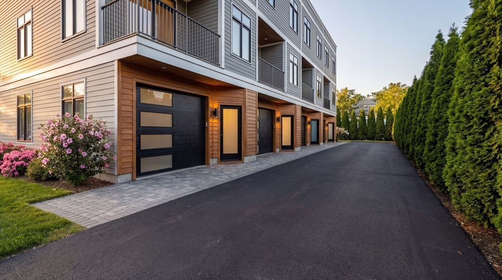 15 Tanglewood Road, Unit A Boston, MA 02126 - Photo 1 of 28 a view of a building with a yard