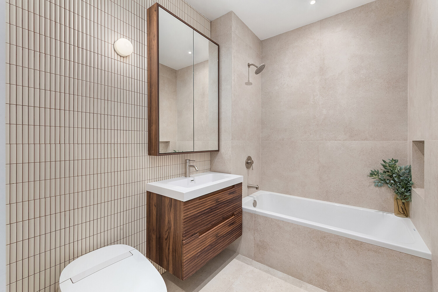 701 Prospect Place, Unit 202 Brooklyn, NY 11216 - Photo 5 of 7 a bathroom with a sink a toilet and shower