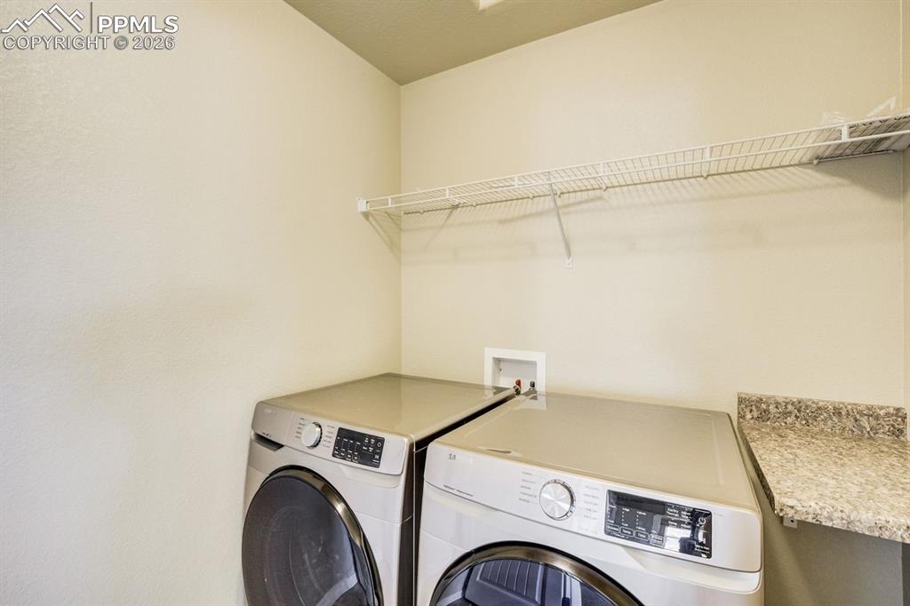 Undisclosed Address Colorado Springs, CO 80925 - Photo 30 of 45 a utility room with dryer and washer