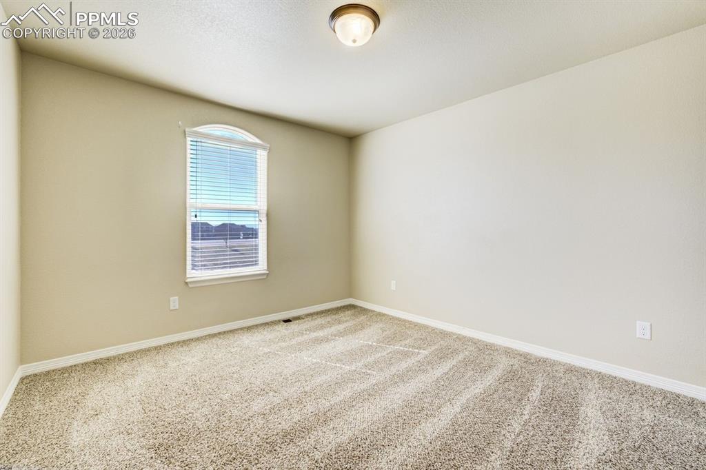 Undisclosed Address Colorado Springs, CO 80925 - Photo 31 of 45 an empty room with a window