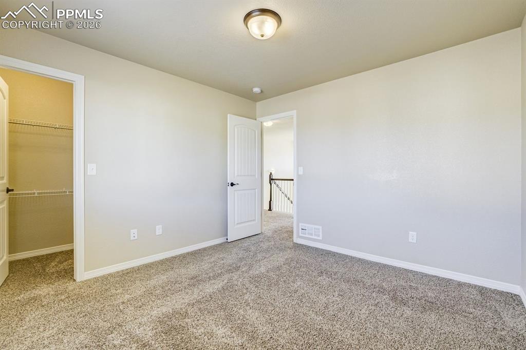 Undisclosed Address Colorado Springs, CO 80925 - Photo 33 of 45 an empty room with closet and a window