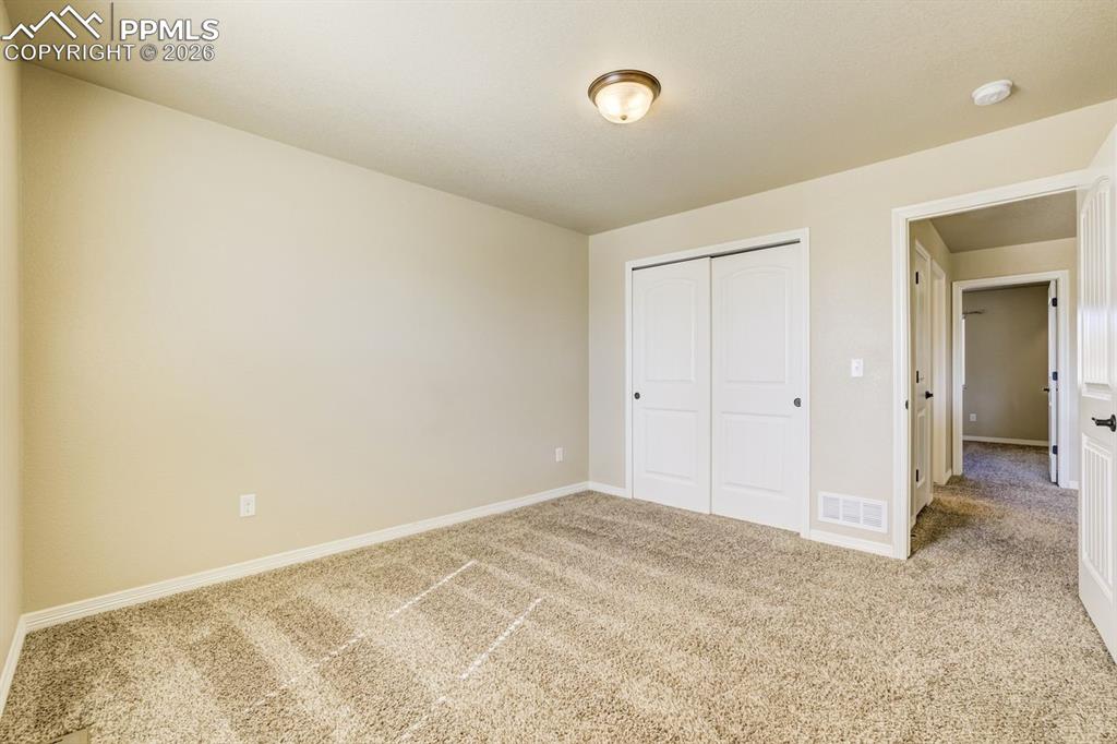 Undisclosed Address Colorado Springs, CO 80925 - Photo 39 of 45 an empty room with a natural light
