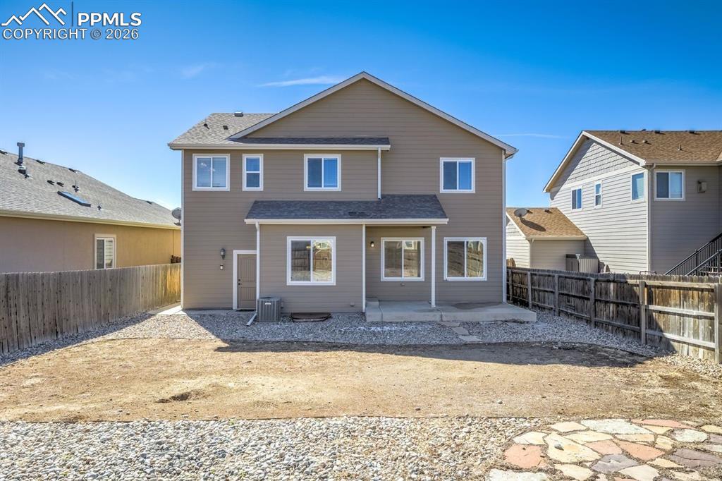 Undisclosed Address Colorado Springs, CO 80925 - Photo 40 of 45 a front view of a house with a yard