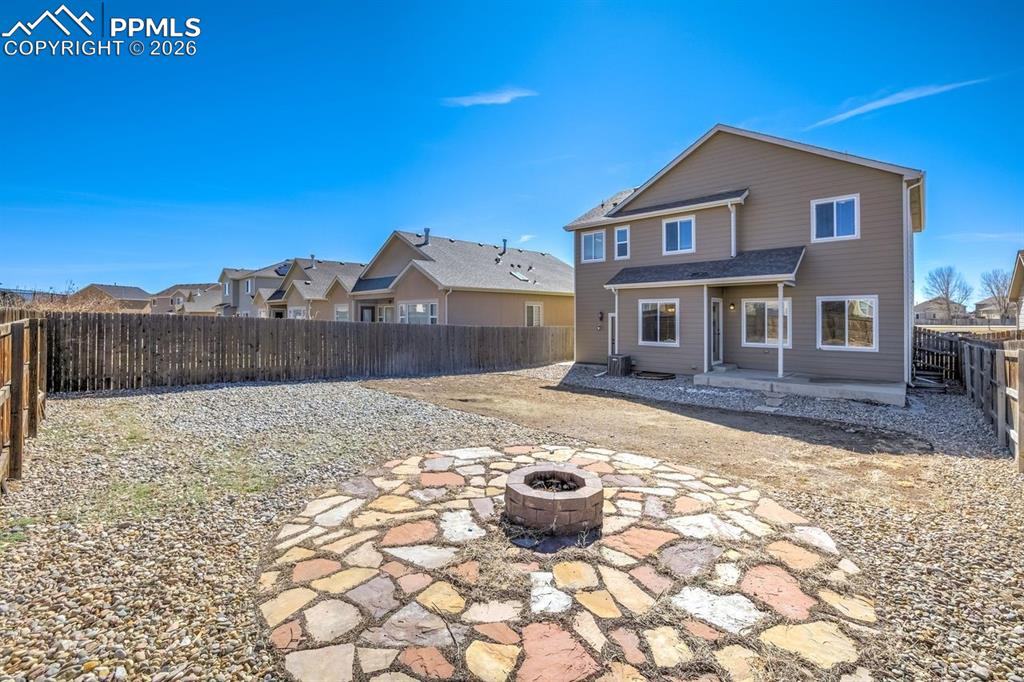 Undisclosed Address Colorado Springs, CO 80925 - Photo 41 of 45 a view of a house with backyard and sitting area