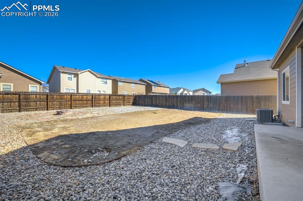 Undisclosed Address Colorado Springs, CO 80925 - Photo 42 of 45 a view of a backyard with a swimming pool