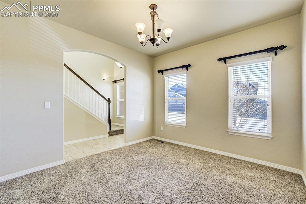 Undisclosed Address Colorado Springs, CO 80925 - Photo 7 of 45 a view of a hallway with windows