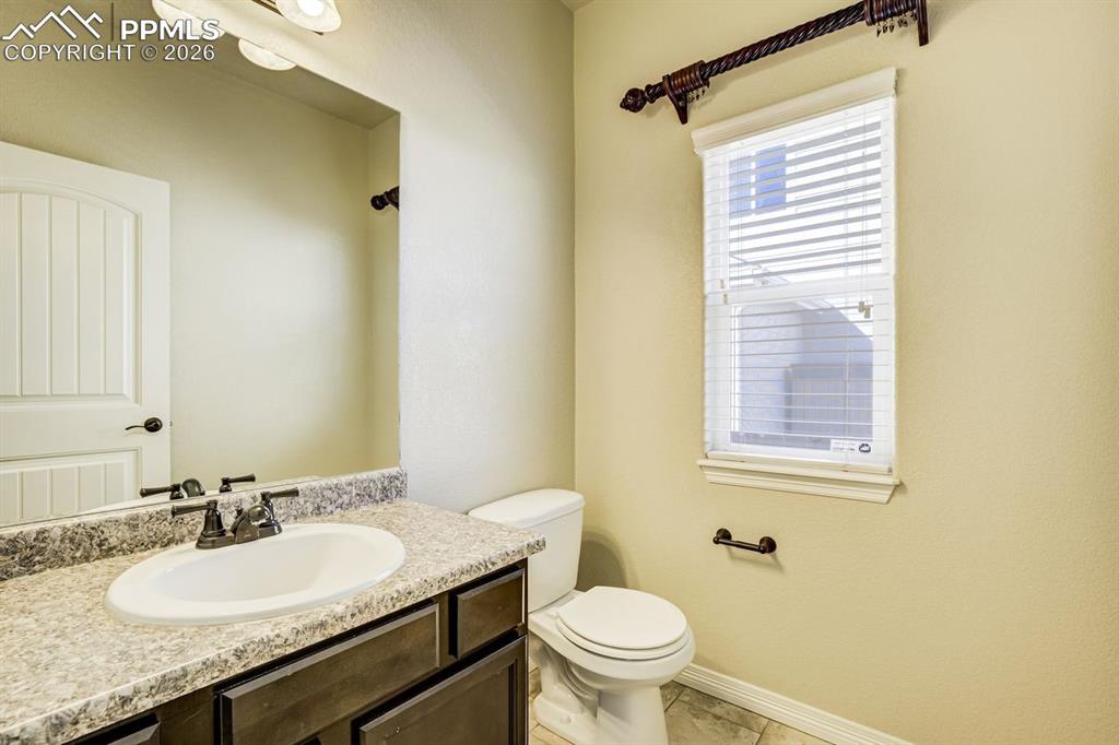 Undisclosed Address Colorado Springs, CO 80925 - Photo 9 of 45 a bathroom with a granite countertop sink toilet and shower