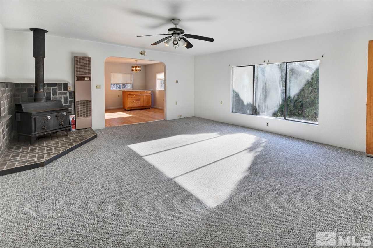 4320 Reno Highway Fallon, NV 89406 - Photo 8 of 28 a living room with furniture and a flat screen tv