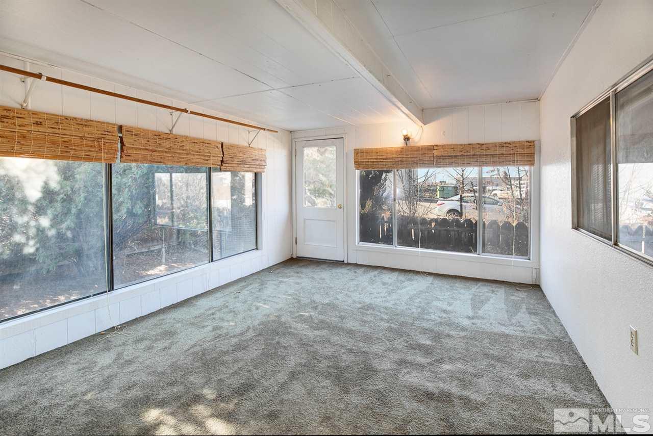 4320 Reno Highway Fallon, NV 89406 - Photo 9 of 28 an empty room with wooden floor and windows