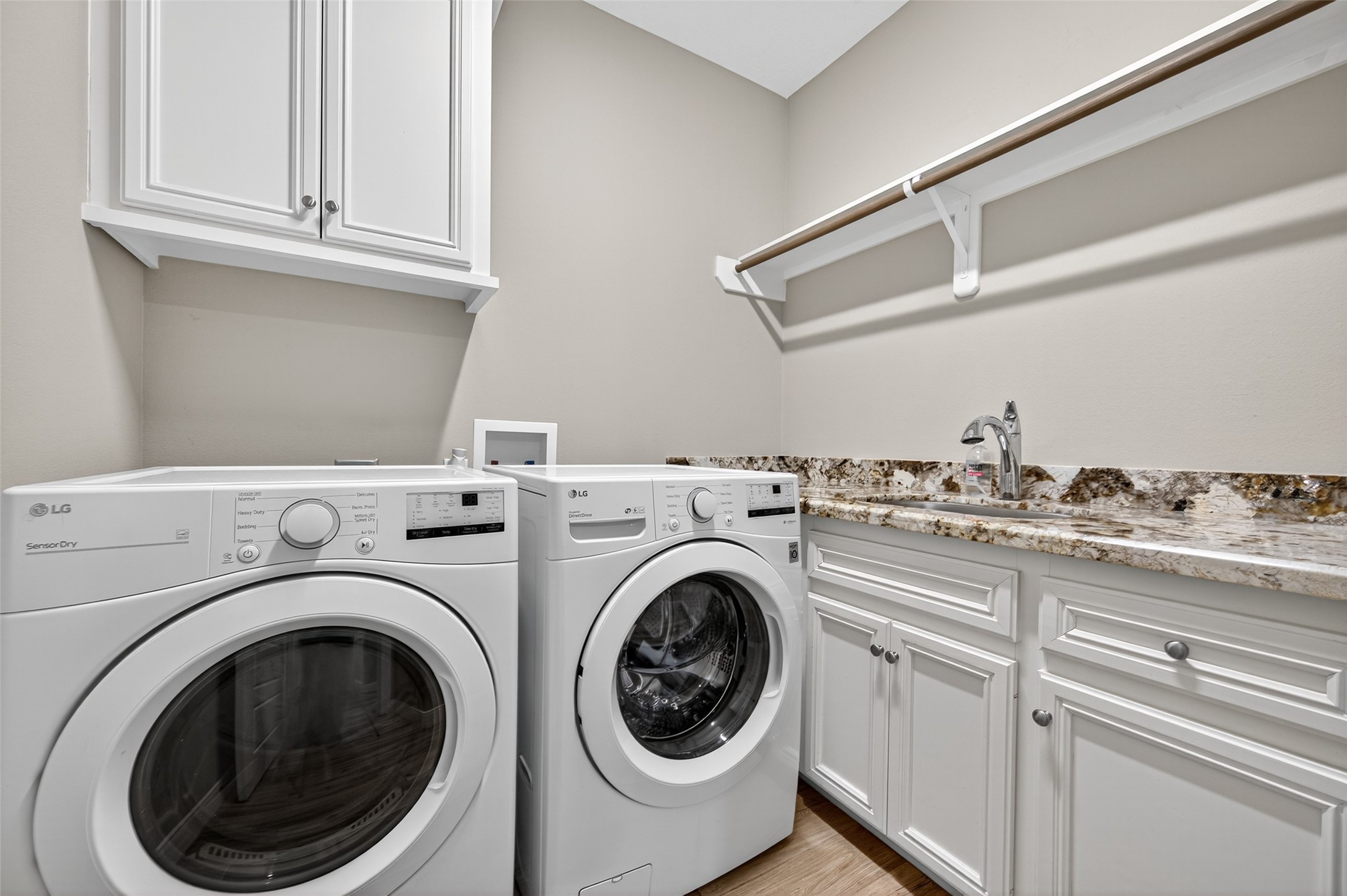 12322 High Fire Road Montgomery, TX 77356 - Photo 22 of 45 Laundry room complete with granite counter tops and a sink.