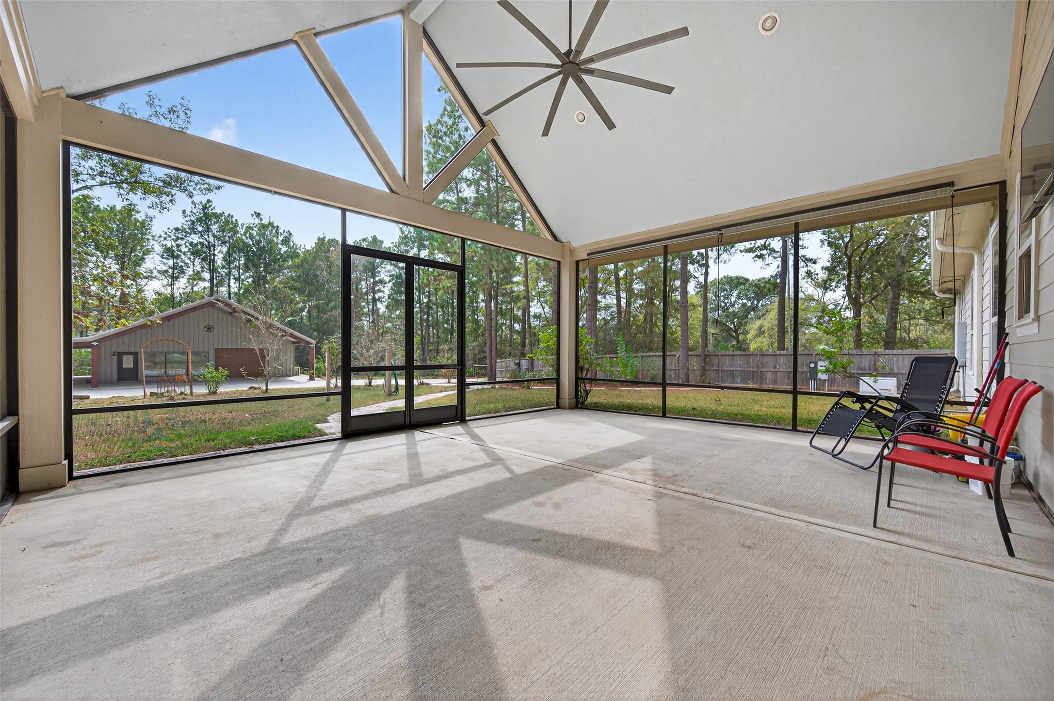 12322 High Fire Road Montgomery, TX 77356 - Photo 34 of 45 Massive screened in porch off the home with beautiful views of the backyard!