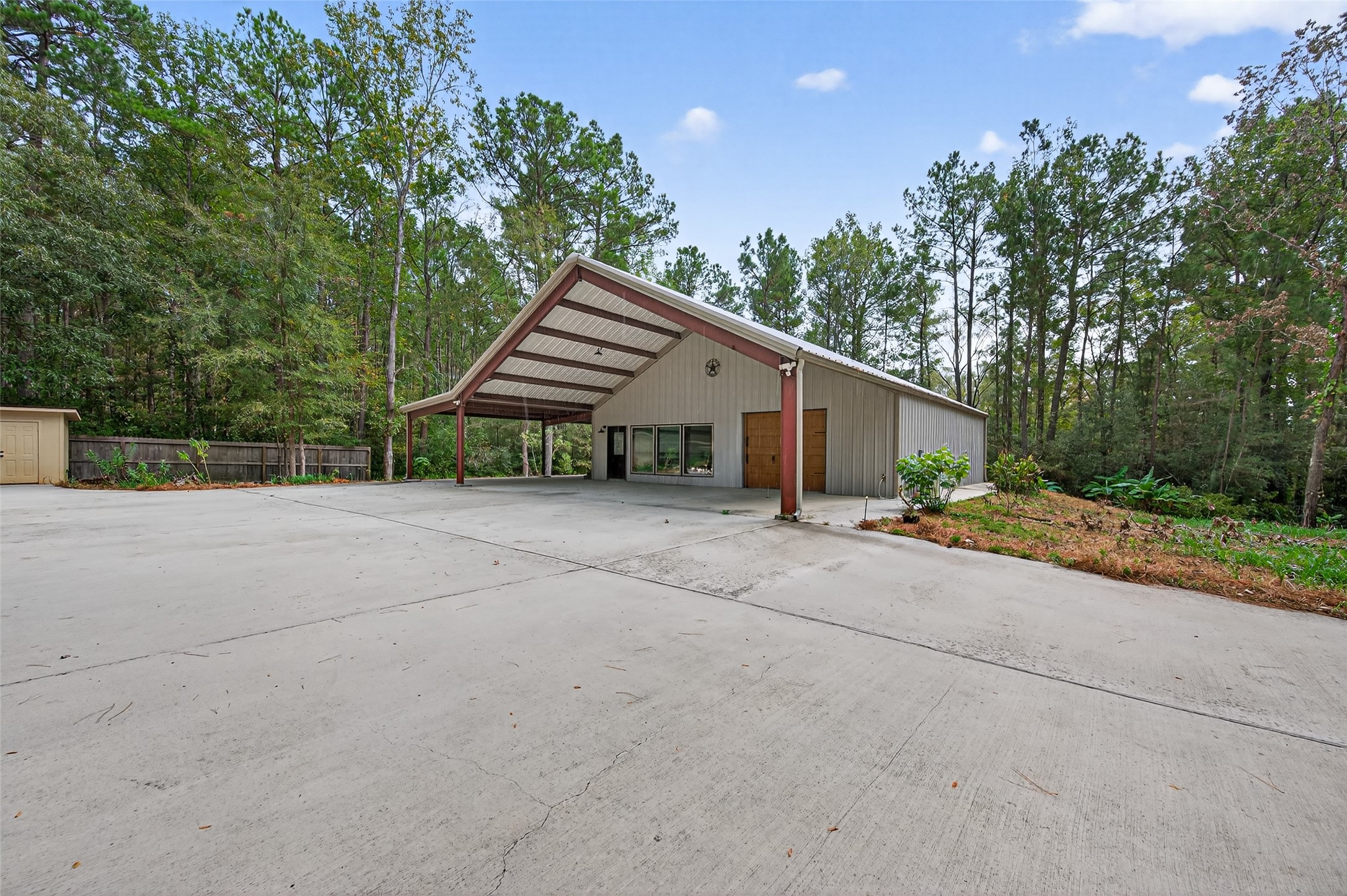 12322 High Fire Road Montgomery, TX 77356 - Photo 35 of 45 1600 squarefoot workship with private gated driveways and tons of concrete for parking.