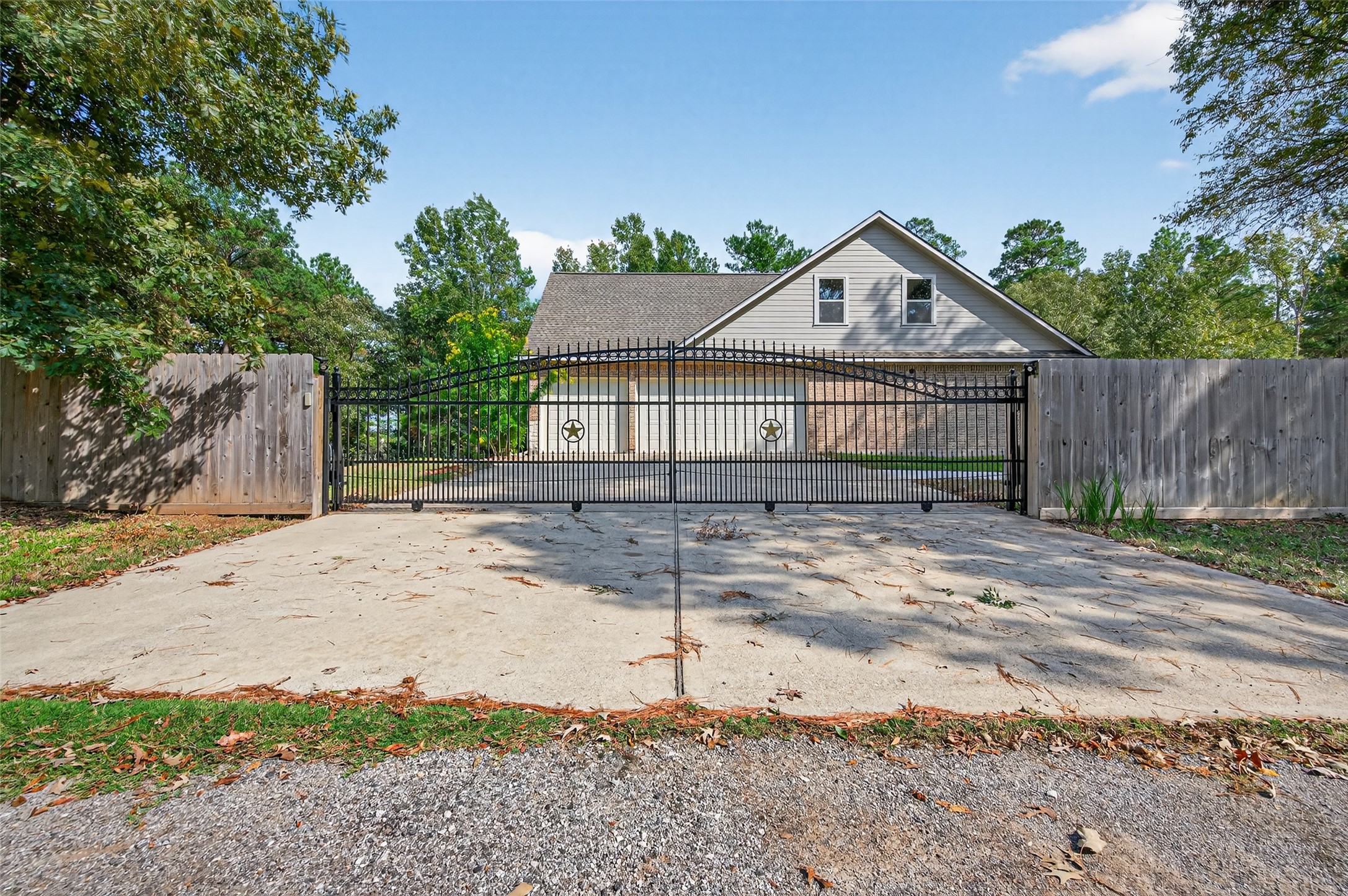12322 High Fire Road Montgomery, TX 77356 - Photo 41 of 45 Gated driveway #1 with direct access to the 3 car garage.