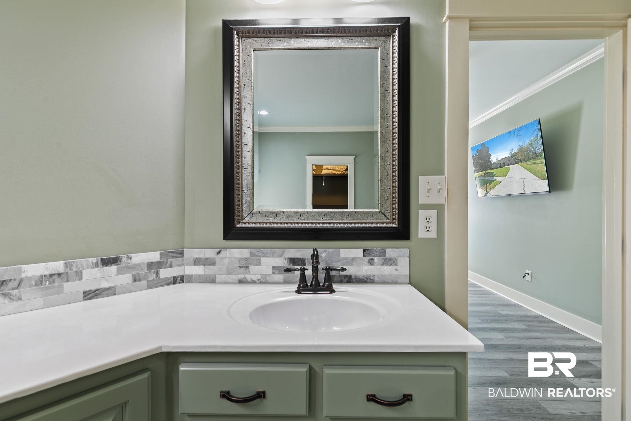 9584 Sanibel Loop Daphne, AL 36526 - Photo 25 of 48 Bathroom featuring vanity, wood finished floors, and crown molding