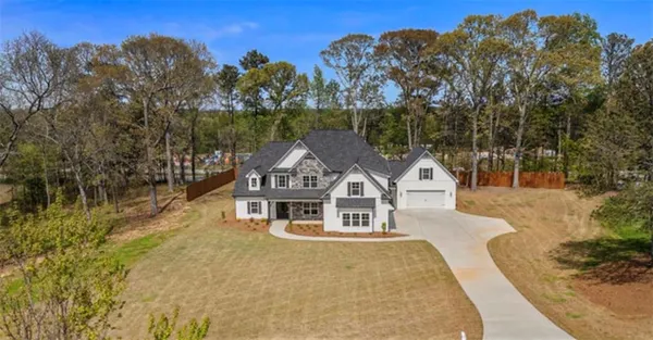 a house with trees in the background