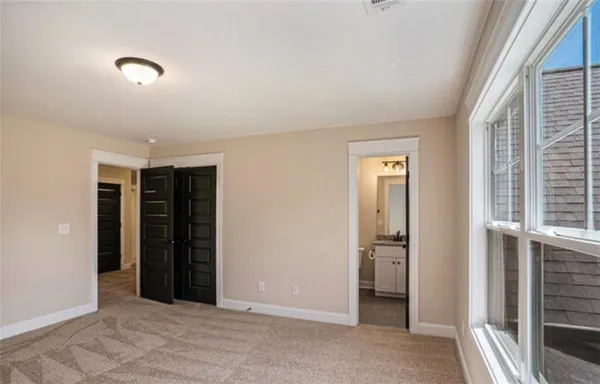 a bathroom with a granite countertop toilet a sink and a bathtub