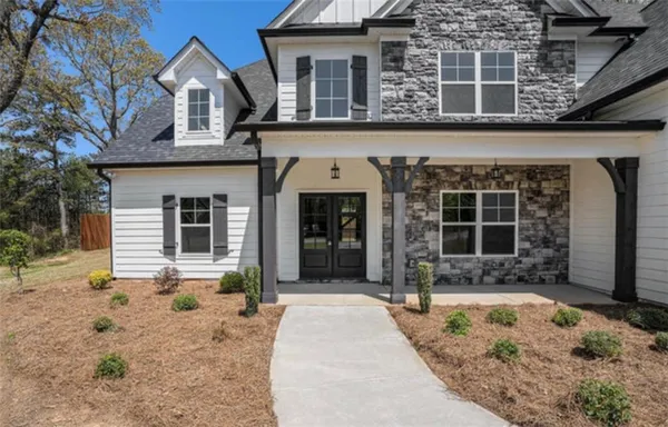 front view of a house with a yard