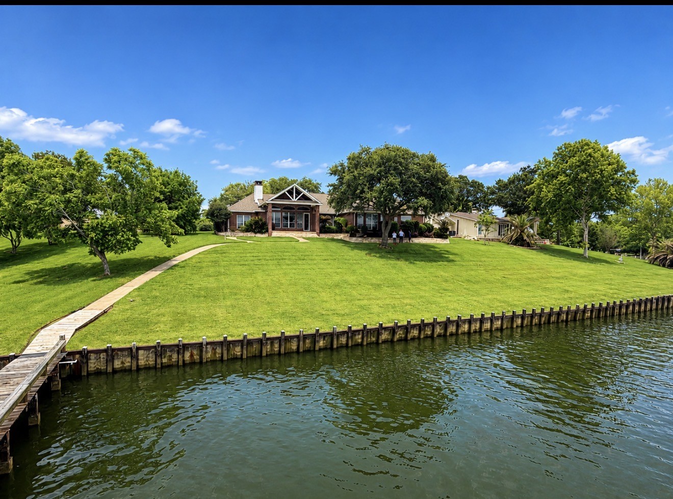 430 Fawn Road Livingston, TX 77351 - Photo 29 of 47 a view of a lake with a building in the background