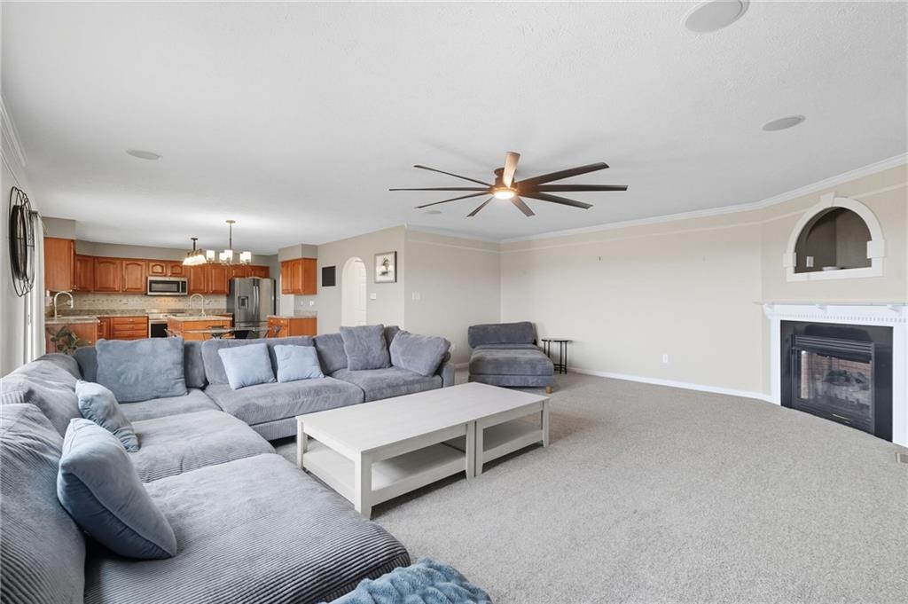 499 West Spring Grove Boulevard Rostraver Township, PA 15012 - Photo 12 of 46 a living room with furniture and a fireplace