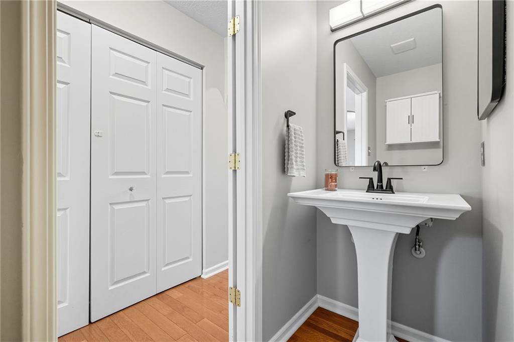 499 West Spring Grove Boulevard Rostraver Township, PA 15012 - Photo 13 of 46 a bathroom with a sink and a mirror