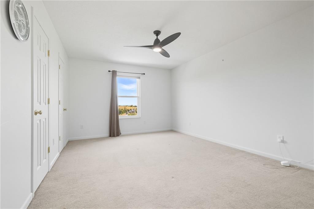499 West Spring Grove Boulevard Rostraver Township, PA 15012 - Photo 26 of 46 an empty room with windows and fan