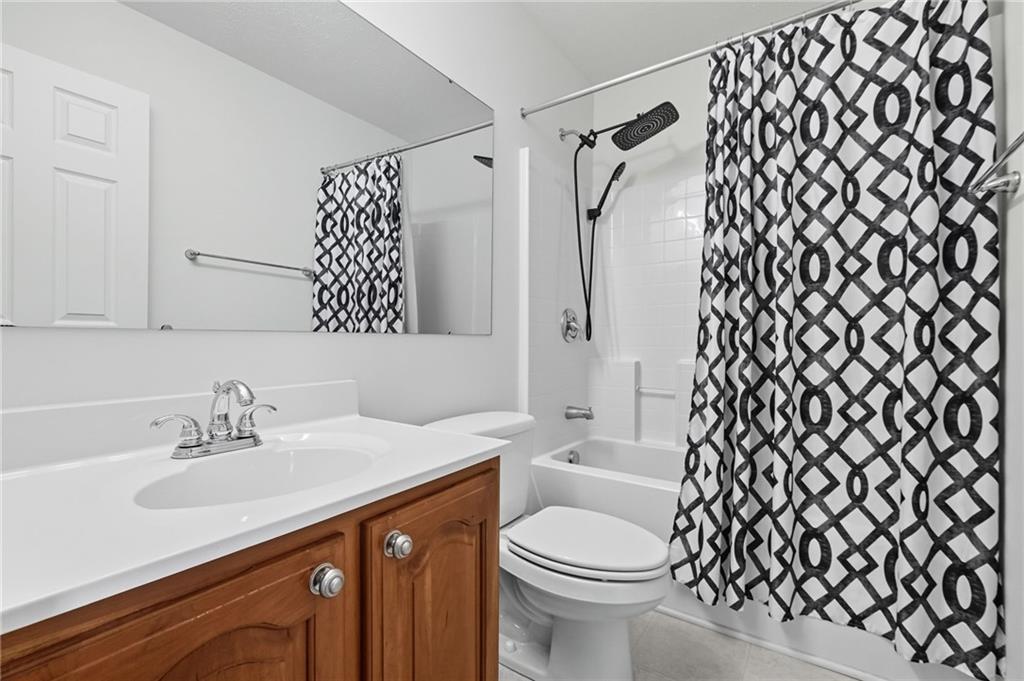 499 West Spring Grove Boulevard Rostraver Township, PA 15012 - Photo 27 of 46 a bathroom with a sink a toilet and shower