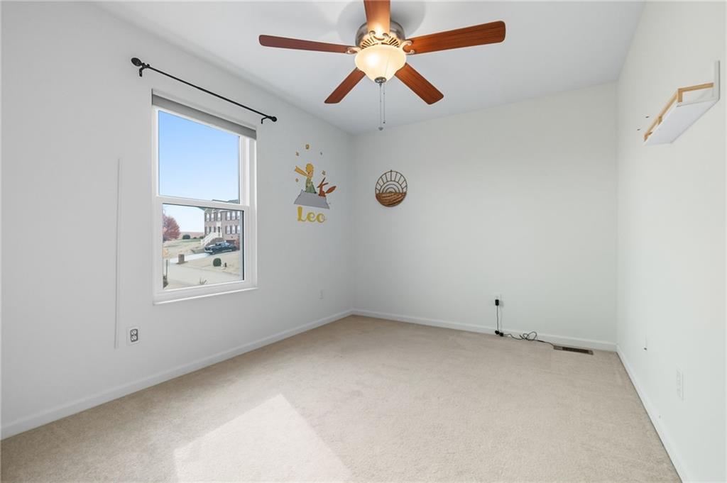 499 West Spring Grove Boulevard Rostraver Township, PA 15012 - Photo 29 of 46 an empty room with windows and fan