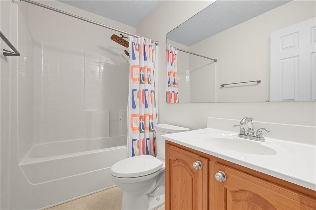 499 West Spring Grove Boulevard Rostraver Township, PA 15012 - Photo 30 of 46 a bathroom with a sink toilet and shower
