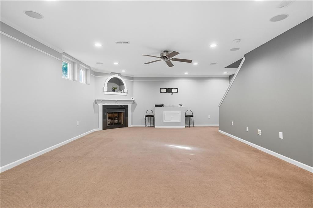 499 West Spring Grove Boulevard Rostraver Township, PA 15012 - Photo 32 of 46 an empty room with windows and fireplace