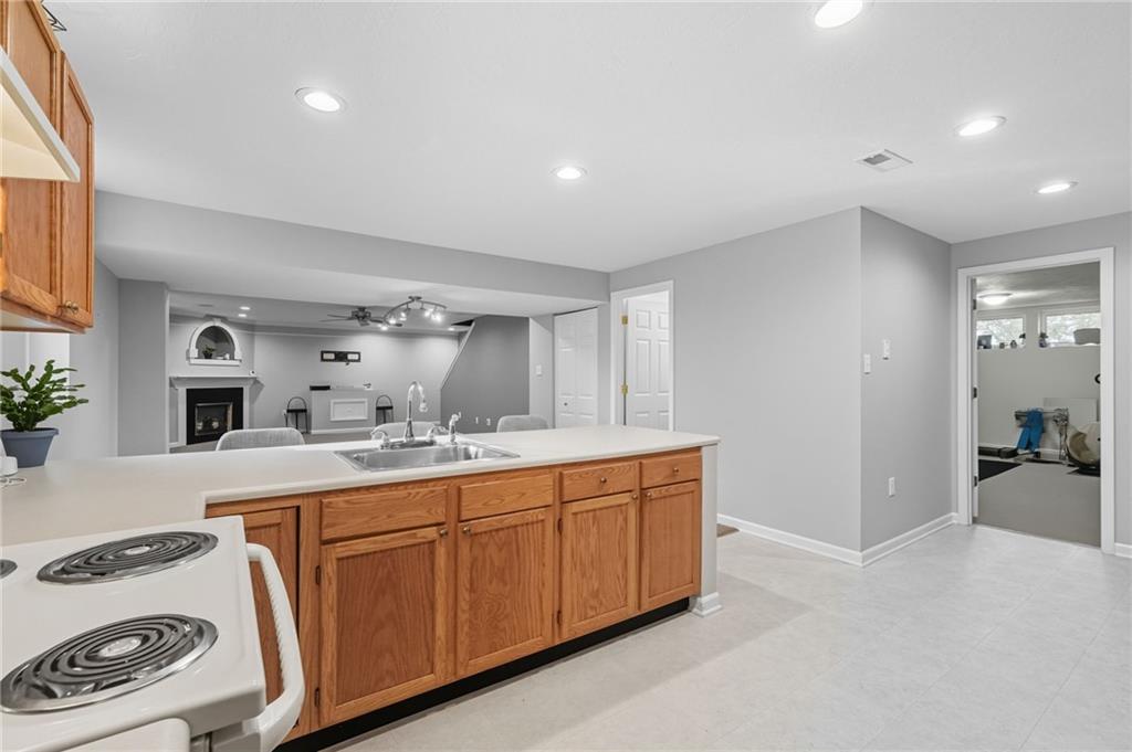 499 West Spring Grove Boulevard Rostraver Township, PA 15012 - Photo 36 of 46 a view of a sink and dishwasher with wooden floor
