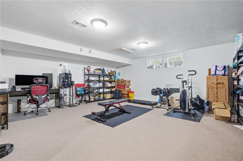499 West Spring Grove Boulevard Rostraver Township, PA 15012 - Photo 37 of 46 a view of a room with gym equipment