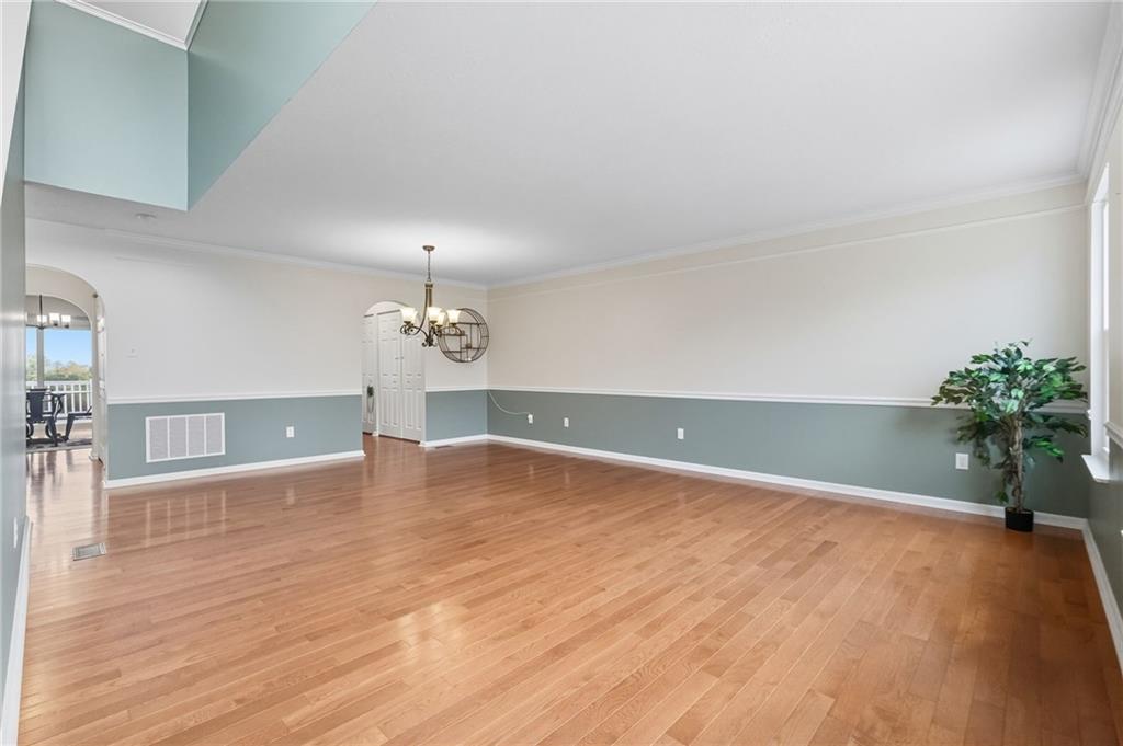 499 West Spring Grove Boulevard Rostraver Township, PA 15012 - Photo 4 of 46 a view of an empty room with a chandelier