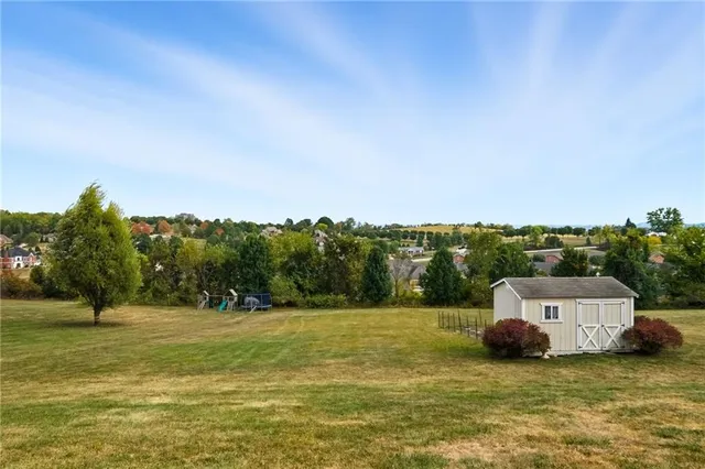 a view of front of house with a yard