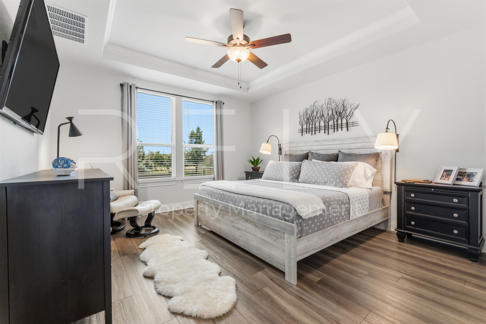 101 Spanish Star Street Georgetown, TX 78633 - Photo 21 of 39 Natural light illuminates this tranquil primary suite with soaring tray ceilings.