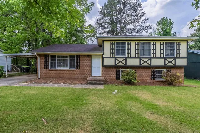 front view of a house with a yard