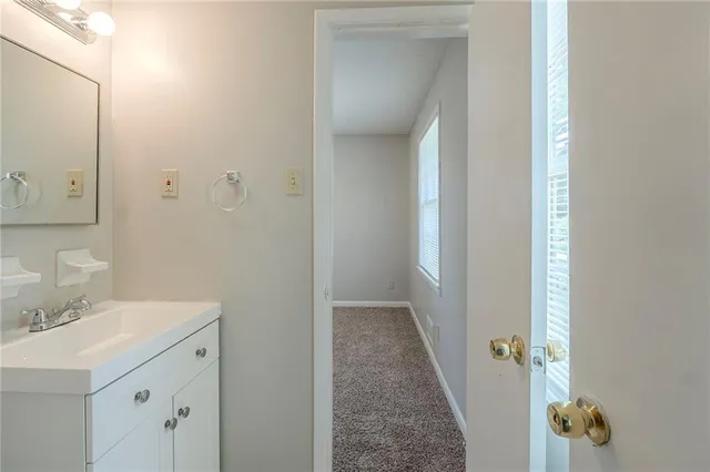 a bathroom with a sink and mirror